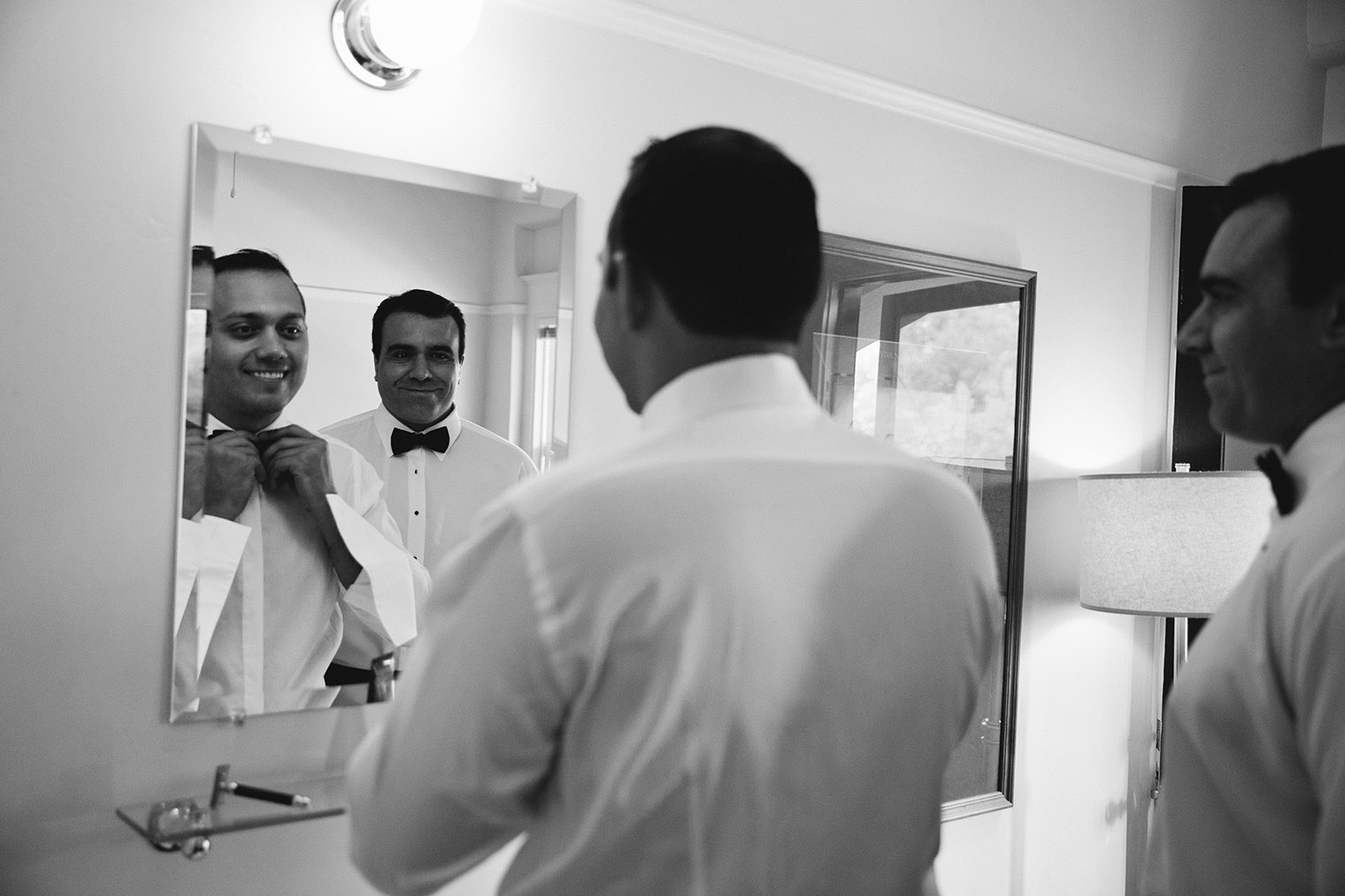 groom getting ready in wine country