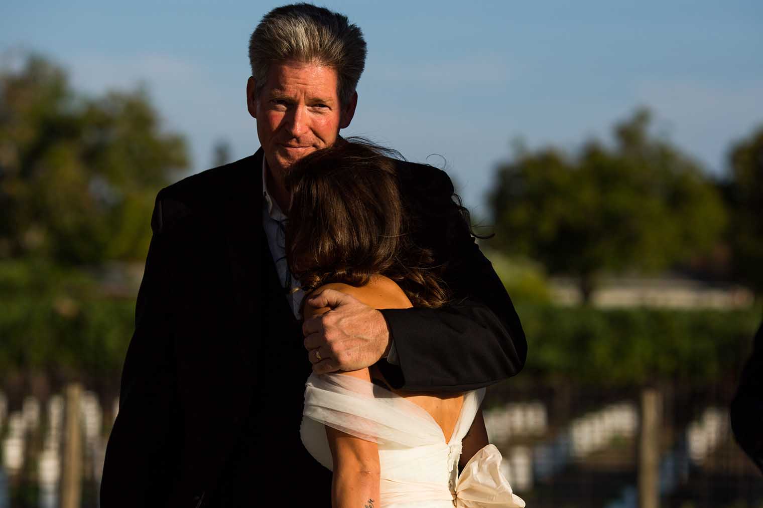candid moment between father and bride