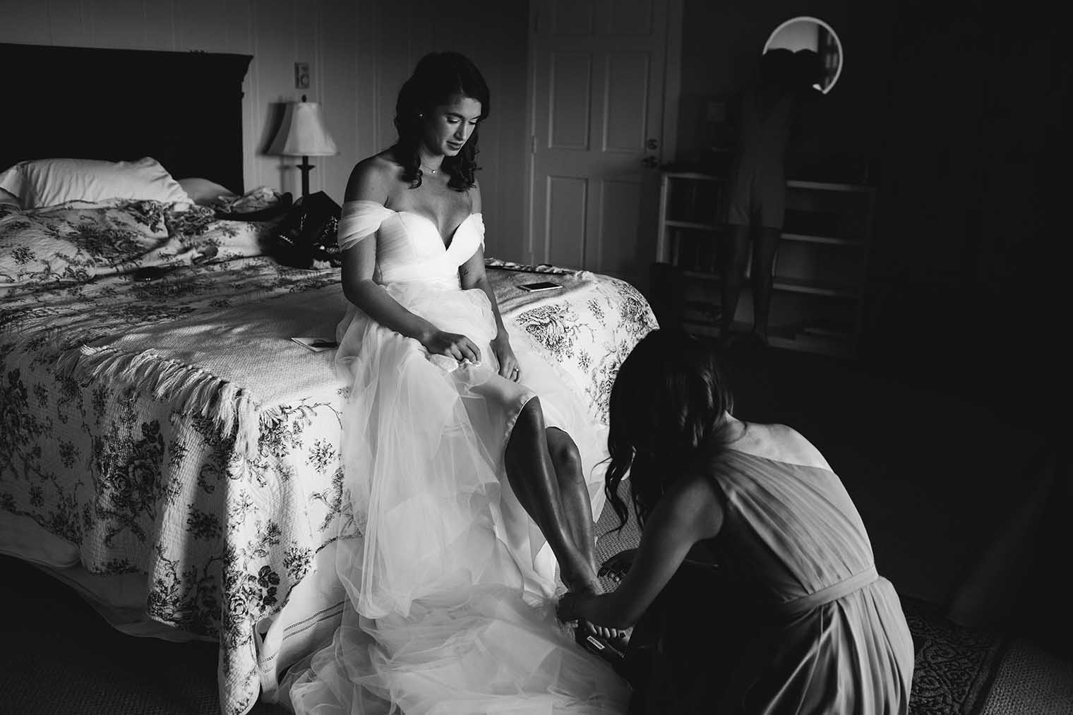 Bride putting on shoes